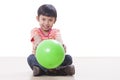 Boy playing green ball Royalty Free Stock Photo