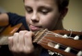 Boy playing guitar Royalty Free Stock Photo