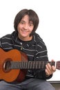 Boy playing guitar Royalty Free Stock Photo