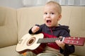 Boy playing the guitar