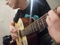 Boy playing guitar song evening