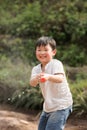 Boy playing happily with a water gun