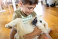 Boy playing with his dog Royalty Free Stock Photo