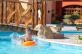 Boy playing in hotel pool Royalty Free Stock Photo