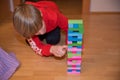 Boy playing Jenga game