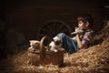 Boy playing with kittens in the barn Royalty Free Stock Photo