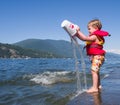 Boy playing at lake Royalty Free Stock Photo