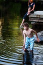 Boy playing in a lake Royalty Free Stock Photo