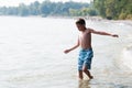 Boy playing in a lake Royalty Free Stock Photo