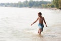 Boy playing in a lake Royalty Free Stock Photo
