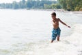 Boy playing in a lake Royalty Free Stock Photo