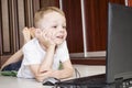 Boy playing laptop Royalty Free Stock Photo