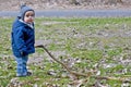 Boy playing with long stick