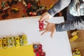 Boy playing many little cars Royalty Free Stock Photo