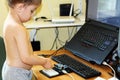 Boy playing with microcontroller Royalty Free Stock Photo