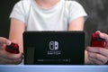 Boy playing Nintendo Switch video game console
