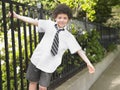 Boy Playing Out Of The School Fence Royalty Free Stock Photo