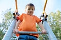 Boy playing outdoors on bar gym. Kid on playground,children activity. Child having fun. Active healthy childhood