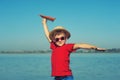 Boy playing outdoors with paper airplanes Royalty Free Stock Photo