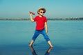 Boy playing outdoors with paper airplanes Royalty Free Stock Photo