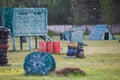 Boy is playing paintball on the field. two teams of paintball players in camouflage form with masks, helmets, guns on the field Royalty Free Stock Photo