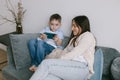 Boy playing phone on the sofa. Royalty Free Stock Photo