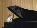 Boy Playing Piano In Music Class Royalty Free Stock Photo