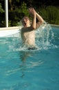 Boy playing in pool Royalty Free Stock Photo