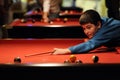 Boy playing pool ball Royalty Free Stock Photo