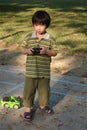 Boy playing remote control car Royalty Free Stock Photo
