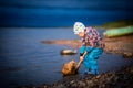 boy playing by the river, selective focus Royalty Free Stock Photo