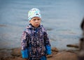 boy playing by the river, selective focus Royalty Free Stock Photo