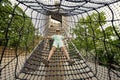 Boy playing in rocket slide ropes at children`s playground in public park Royalty Free Stock Photo