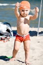 Boy playing in the sand on the beach