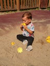 Boy playing in a sand box Royalty Free Stock Photo