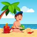 Boy playing sand castles game sitting on sea shore Royalty Free Stock Photo