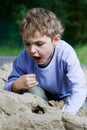 Boy playing in the sandbox Royalty Free Stock Photo