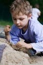 Boy playing in the sandbox Royalty Free Stock Photo