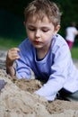 Boy playing in the sandbox Royalty Free Stock Photo