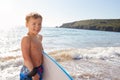 Boy Playing In Sea With Bodyboard On Summer Beach Vacation Royalty Free Stock Photo