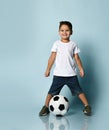 Boy playing soccer, happy child, young male teenager goalkeeper enjoying sports game, holding ball Royalty Free Stock Photo