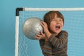 Boy playing with a socker ball