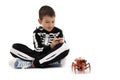 Boy playing with spider robot toy  isolated on white Royalty Free Stock Photo