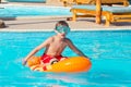 Boy playing in swimming pool