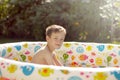 Boy playing in a swimming pool Royalty Free Stock Photo