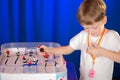 Boy playing table hockey Royalty Free Stock Photo