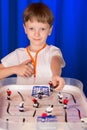 Boy playing table hockey Royalty Free Stock Photo