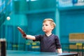 Boy playing table tennis indoors Royalty Free Stock Photo