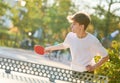 boy playing table tennis ping pong outdoors Royalty Free Stock Photo