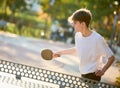 boy playing table tennis ping pong outdoors Royalty Free Stock Photo